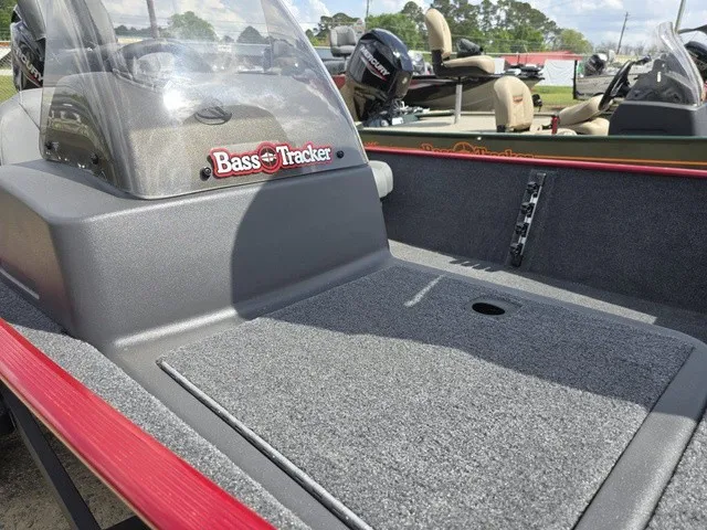 Slide: The Image of The image shows the deck of a 2025 Tracker Bass Tracker Classic XL with gray carpeting. - 25