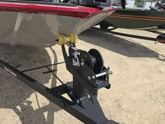 Slide: The Image of A boat on a trailer with a winch and yellow rollers, ready for transport. - 24