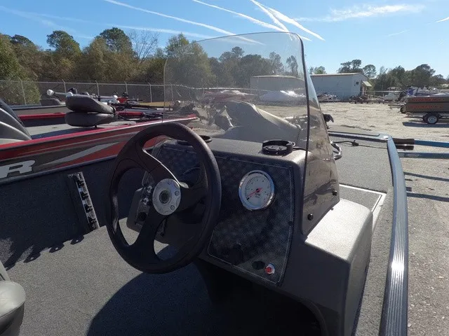 Slide: The Image of The image shows the cockpit of a 2026 Tracker Bass Tracker Classic XL with a steering wheel and gauges. - 11