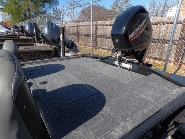 Slide: The Image of The image shows the rear of a Tracker Bass Tracker Classic XL boat with a Mercury outboard motor. - 7