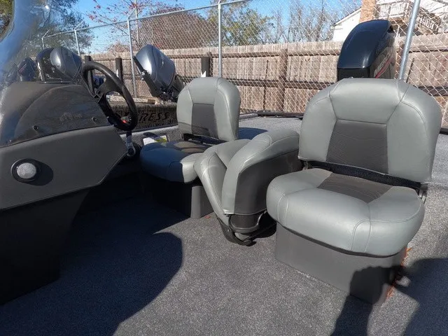 Slide: The Image of The image shows the interior of a 2026 Tracker Bass Tracker Classic XL with gray seats. - 6