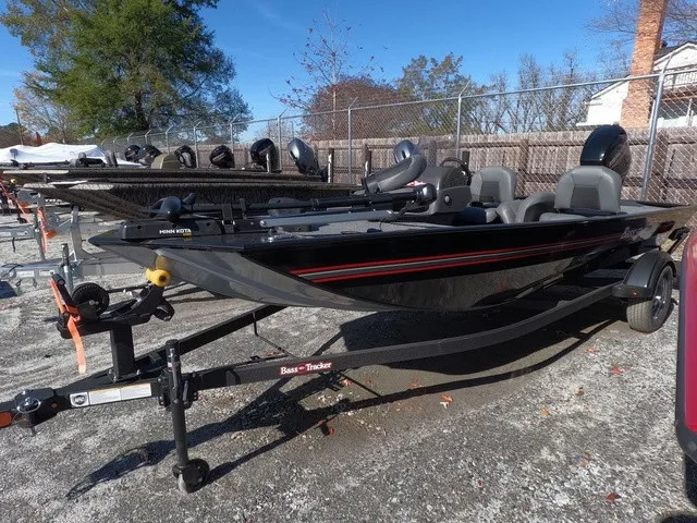 Slide: The Image of 2026 Tracker Bass Tracker Classic XL in a storage area. - 3