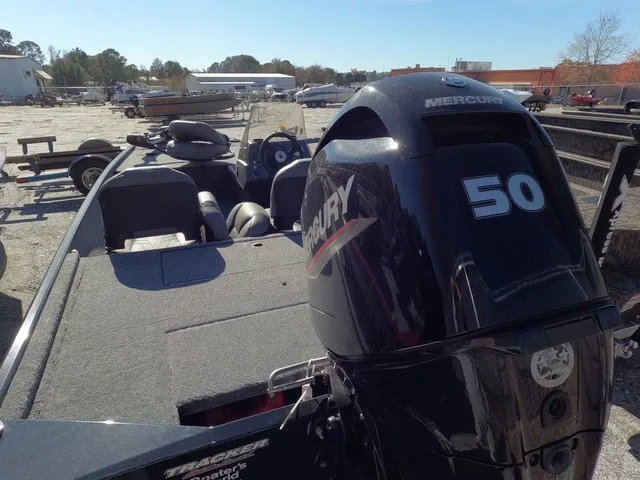 Slide: The Image of A 2026 Tracker Bass Tracker Classic XL with a Mercury 50 outboard motor, parked on a gravel lot. - 8
