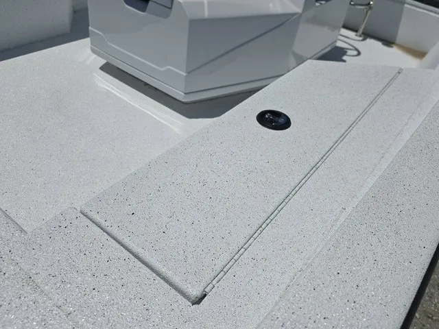 Slide: The Image of Close-up of a white boat deck with textured finish and a black hatch. - 15