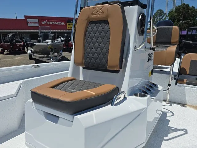 Slide: The Image of The image shows the helm of a 2026 Xpress SW20B boat with a cushioned seat. - 16