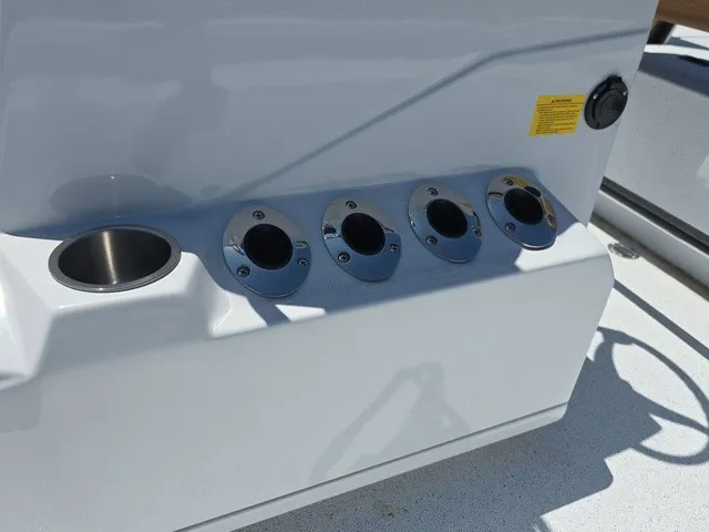 Slide: The Image of The image shows a white boat console with four round mounts and a cup holder. - 17