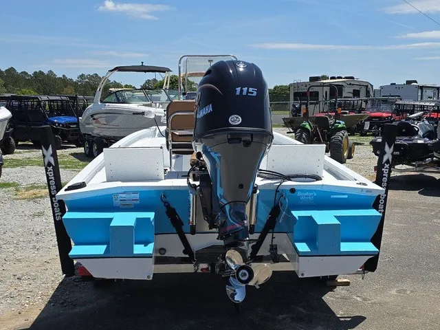 Slide: The Image of The image shows a 2026 Xpress SW20B boat with a Yamaha 115 engine. - 8