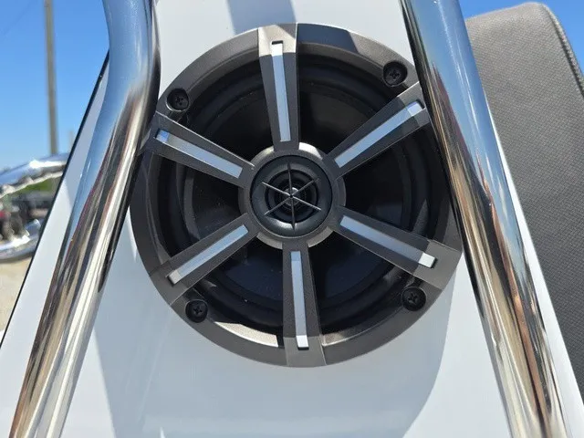 Slide: The Image of A speaker is integrated into the white surface of a boat, surrounded by metal bars. - 35