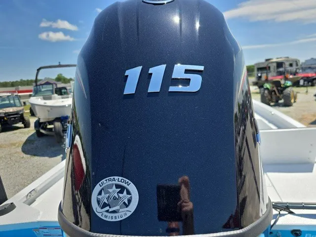 Slide: The Image of An outboard motor labeled "115" with an Ultra-Low Emission logo. - 30