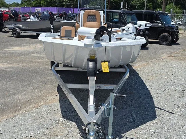 Slide: The Image of A 2026 Xpress SW20B boat is on a trailer in a gravel lot. - 4