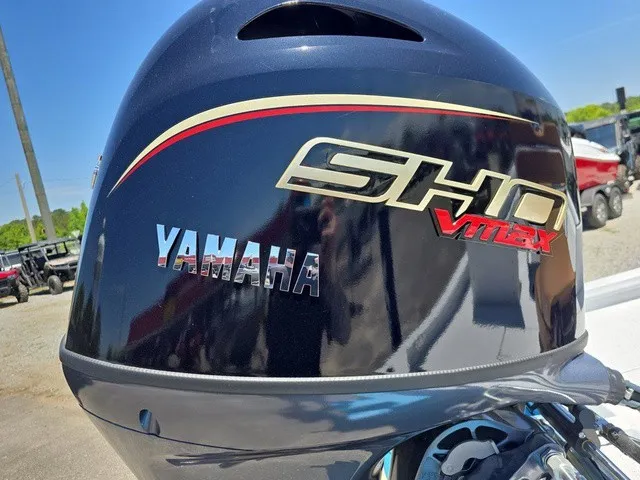 Slide: The Image of Yamaha outboard motor with SHO VMAX logo, mounted on a boat, outdoors. - 29