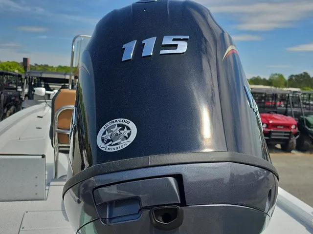 Slide: The Image of An outboard motor labeled "115" is mounted on a boat. - 11