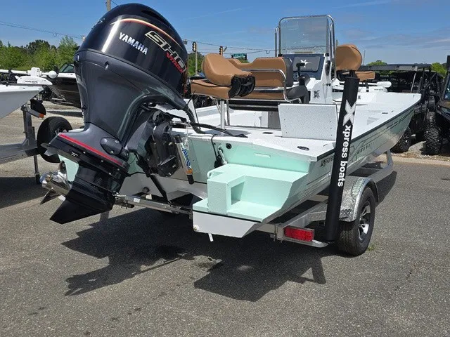 Slide: The Image of The image shows a 2026 Xpress SW20B boat with a Yamaha outboard motor. - 8