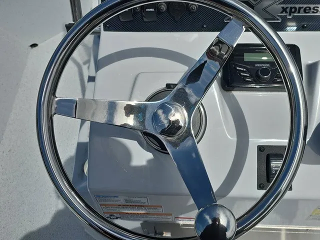 Slide: The Image of Steering wheel of a 2026 Xpress SW20B boat. - 26