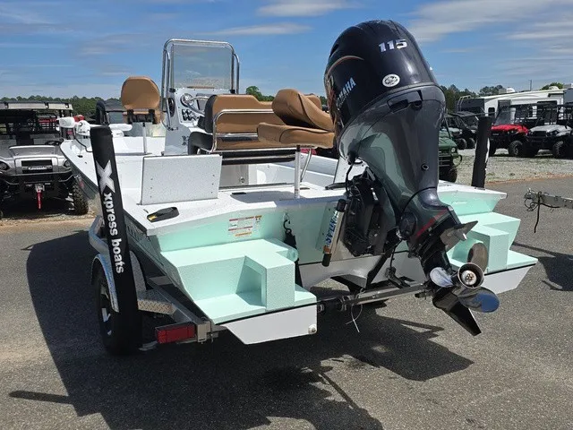 Slide: The Image of A 2026 Xpress SW20B boat with a Yamaha 115 outboard motor, on a trailer. - 6