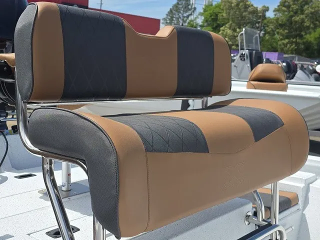 Slide: The Image of The image shows a cushioned boat seat with brown and gray upholstery on an Xpress SW20B boat. - 23