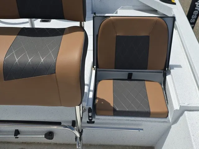 Slide: The Image of The 2026 Xpress SW20B features stylish, cushioned seats in brown and black on a white deck. - 30