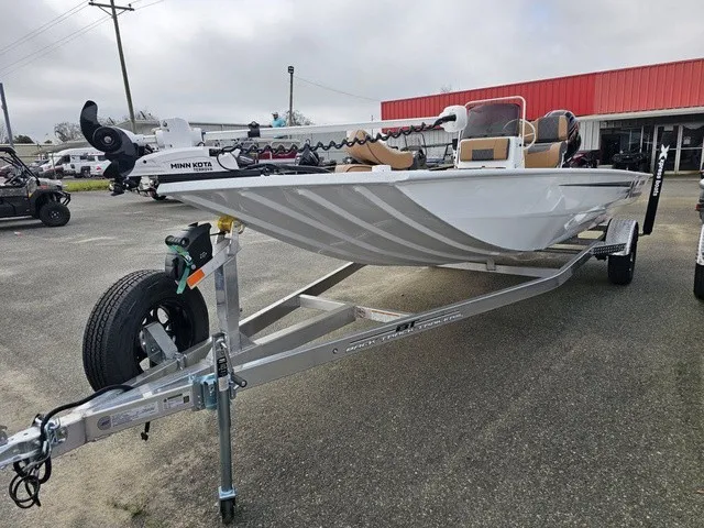 Slide: The Image of A 2026 Xpress XP20CC boat on a trailer, featuring a Minn Kota motor. - 8