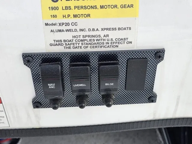 Slide: The Image of Switch panel on an Xpress XP20CC boat with switches for navigation, livewell, and bilge. - 27
