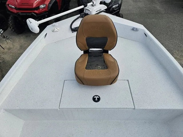 Slide: The Image of A 2026 Xpress XP20CC boat with a brown seat on the deck. - 14