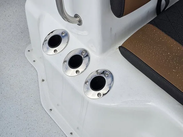 Slide: The Image of Close-up of three stainless steel cup holders on a white boat. - 17