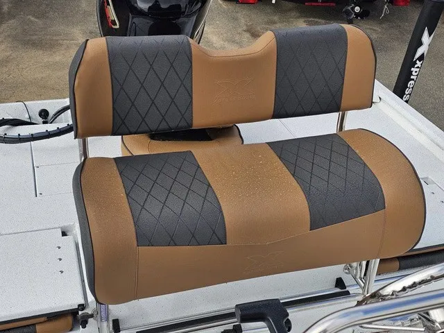 Slide: The Image of The 2026 Xpress XP20CC features stylish, two-tone upholstery with a modern diamond pattern. - 18