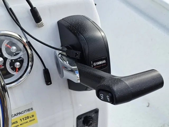 Slide: The Image of Close-up of a boat throttle lever with Yamaha logo, surrounded by gauges and switches. - 25
