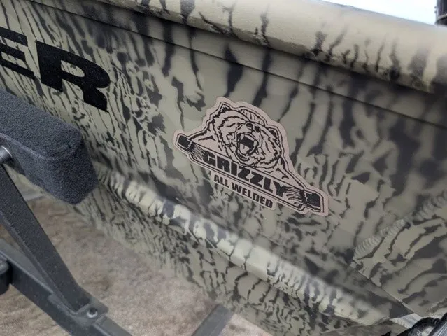 Slide: The Image of Close-up of the Tracker Grizzly 1860 CC with a bear logo and "All Welded" text. - 22