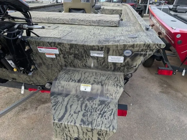 Slide: The Image of The image shows a Tracker Grizzly 1860 CC boat with camouflage pattern and an outboard motor. - 15