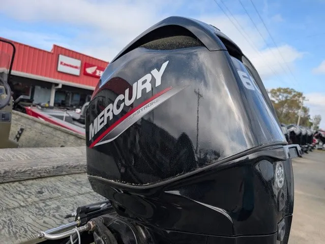 Slide: The Image of A Mercury outboard motor is mounted on a Tracker Grizzly 1860 CC boat. - 18