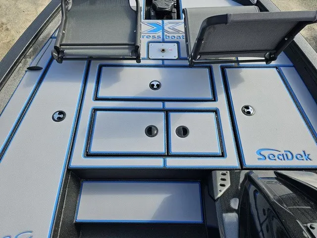 Slide: The Image of The image shows the deck of an Xpress H18C Crappie boat with gray and blue accents. - 30