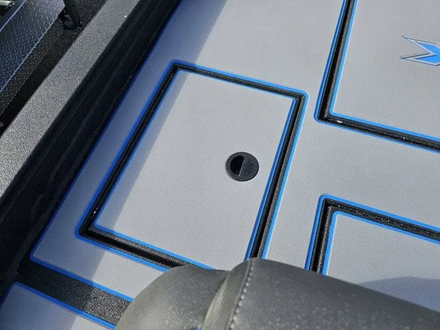 Slide: The Image of Close-up of the deck on an Xpress H18C Crappie boat with blue accents. - 36