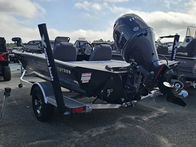 Slide: The Image of A 2026 Xpress H18C Crappie boat with a powerful outboard motor on a trailer. - 6