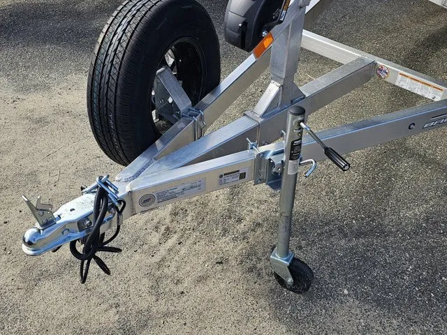 Slide: The Image of Close-up of a boat trailer with a sturdy metal frame and a spare tire. - 14