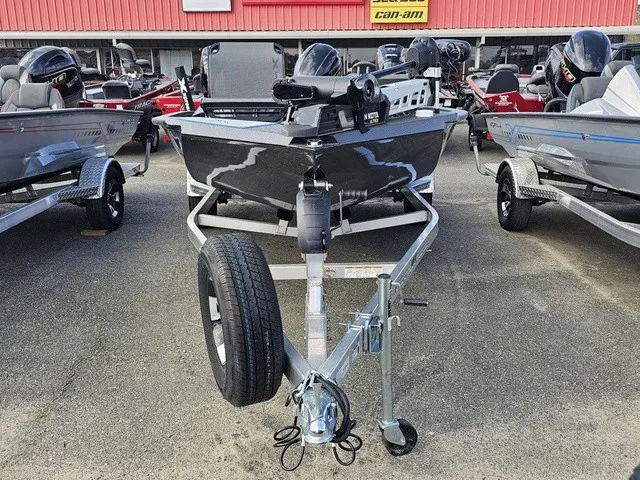 Slide: The Image of A 2026 Xpress H18C Crappie boat on a trailer in a showroom setting. - 5