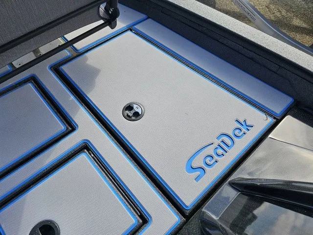 Slide: The Image of The image shows the deck of an Xpress H18C Crappie boat with SeaDek flooring. - 33