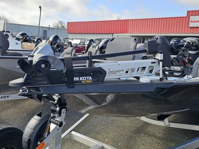 Slide: The Image of An Xpress H18C Crappie boat with Minn Kota Ultrex motor, parked on a trailer. - 3
