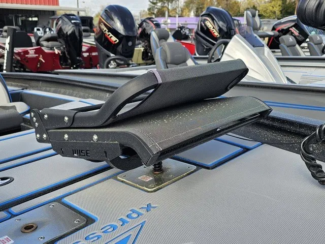 Slide: The Image of Close-up of a seat on an Xpress H18C Crappie boat, surrounded by other boats. - 20
