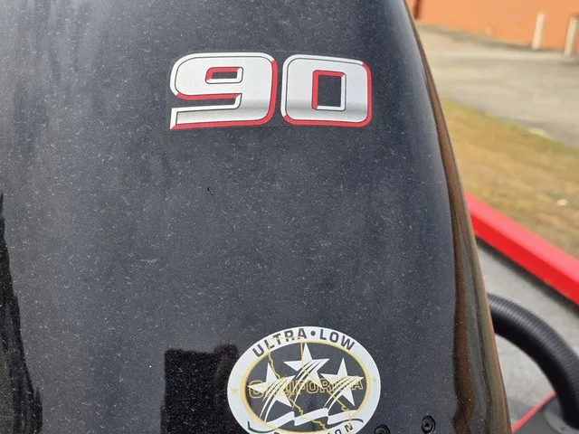 Slide: The Image of Close-up of an outboard motor with the number 90 and an Ultra Low Emissions sticker. - 29