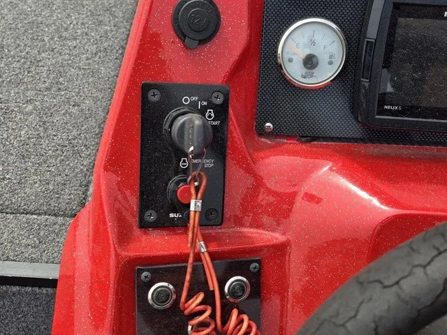 Slide: The Image of Close-up of a Caravelle Raptor 200 boat dashboard with switches and gauges. - 19