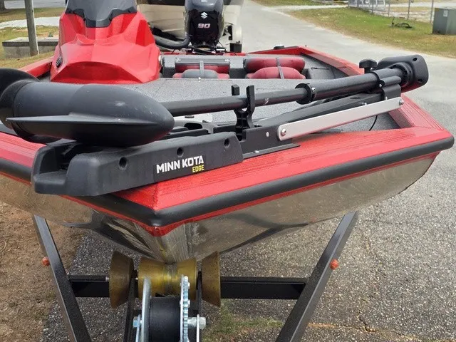 Slide: The Image of A 2021 Caravelle Raptor 200 boat with Minn Kota Edge motor, parked on a trailer. - 4