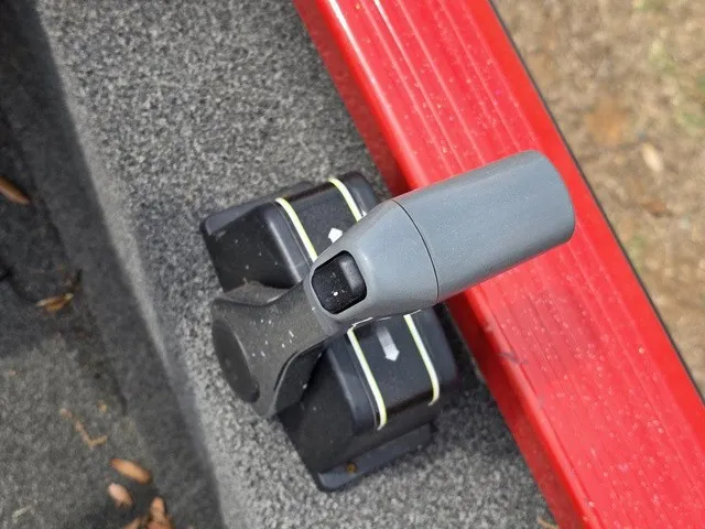 Slide: The Image of Close-up of a gray control lever on a boat with a red edge. - 15