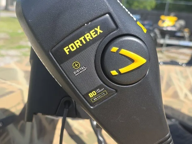 Slide: The Image of Close-up of a Fortrex control unit with digital display and yellow logo. - 31