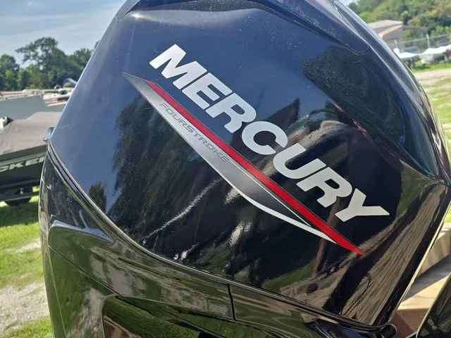 Slide: The Image of Close-up of a Mercury four-stroke outboard motor mounted on a boat. - 24