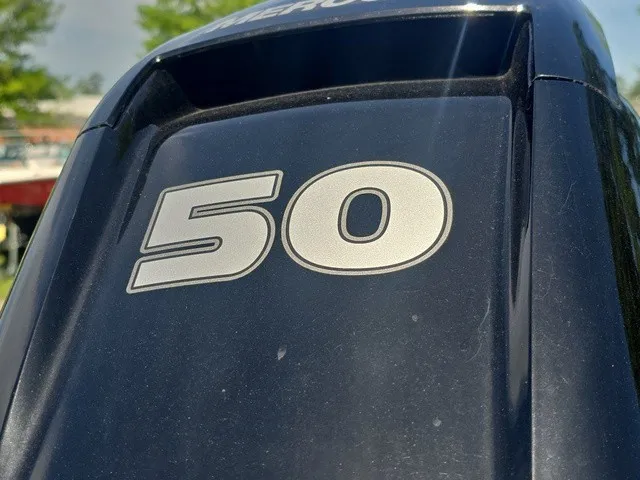 Slide: The Image of Close-up of an outboard motor with the number 50. - 26