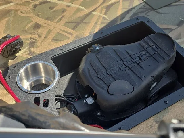 Slide: The Image of Close-up of a boat control system with a cup holder and wiring. - 14