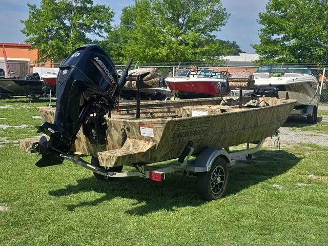 Slide: The Image of A 2025 Lowe RX1760 boat on a trailer outdoors. It features a Mercury outboard motor. - 6