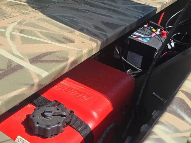 Slide: The Image of A camouflaged Lowe RX1760 showing a red fuel tank and a battery inside. - 28