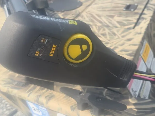 Slide: The Image of Close-up of a boat control device with a yellow button and wires. - 13
