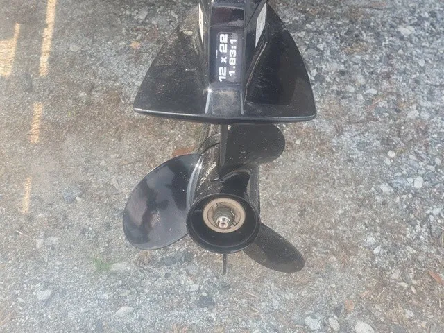 Slide: The Image of Close-up of a boat propeller on a gravel surface. - 20